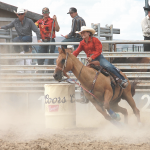 Kate Cooper races around the last barrel heading for the finish line. Avery Layne