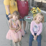 Brianna Sockey (5, in dress), Naomi Coppenbarger (6), Tabitha Sockey (upper left) and Sheri Brown enjoy a stop at Valley Flower and Gifts Saturday during the Lovell Fall Festival. David Peck