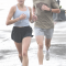 Amee and Matthew Newman stride along on a rainy morning during the Club Dauntless Color Run Saturday morning. Amee Newman won the women’s division. David Peck