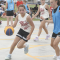 osie Loyning drives against an opponent as teammate Kielley Brimhall looks on during the Lovell’s Days 3-on-3 Tournament Friday afternoon at Armory Park. David Peck