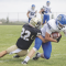 Lovell senior Nathan Cornia (#18) works for extra yardage against Buffalo’s Redic Mader (#22) during Lovell’s 28-8 win on Saturday. Bulletin photo by Joseph Ciembroniewicz