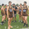 The Grizzly boys cross country team talks race strategy at the starting line just before the race. From left are Jason Unruh, Derek Hedges, Rowan Hanusa, Coach Gerry Burton, James Demers and Ethan Haslem. Mindy Mickelson
