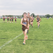 Top Rocky Mountain runner Rowan Hanusa enthusiastically leads his teammates through warmups before a recent race. Joining him are, from left, Jason Unruh, Ethan Haslem and James Demers. Mindy Mickelson