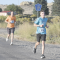Lovell High School sophomore Isaac Sanders leads his cross country coach Caleb Sanders as the pair runs north out of Byron Saturday during the marathon race of the annual Sugar Beet Run. Caleb did pass Isaac later, however, to win the race in 3:38.46, with Isaac finishing in 3:42.01. David Peck