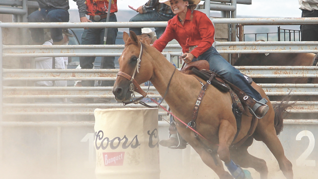 Kate Cooper races around the last barrel heading for the finish line. Avery Layne
