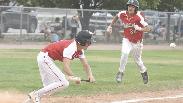 Dallin Bischoff executes a perfect suicide squeeze play as Rocco Rael races in from third base to score during Lovell’s three-run fourth-inning rally against the Cody Cubs last Wednesday night. The Mustangs will play in Cody Monday ahead of the Division II state tournament in Green River July 23-Aug. 3. David Peck