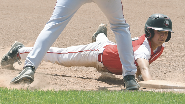 Lovell Mustang Rocco Rael dives back to first base on a pickoff attempt by a Riverton pitcher during a late-season game. Rael’s Mustangs won three of five games at the American Legion Division II State Tournament in Green River this week. David Peck