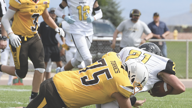 Rocky Mountain senior William Torres crushes a Wright running back during the August 29 zero-week game in Cowley as Jaxson Miller (#3) moves in. The Grizz crushed Southeast 57-12 Friday in Yoder and now travel to Big Piney Friday for their conference opener. Kickoff is set for 1 p.m. David Peck