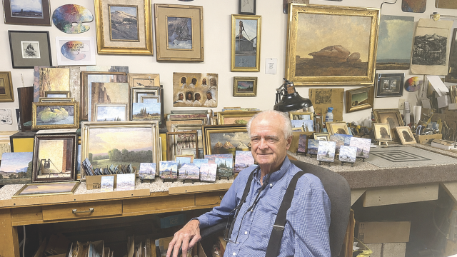 Denney NeVille sits in his Byron studio surrounded by the paintings, sketches and accumulated memories of a lifetime in Western art. John Bernhisel