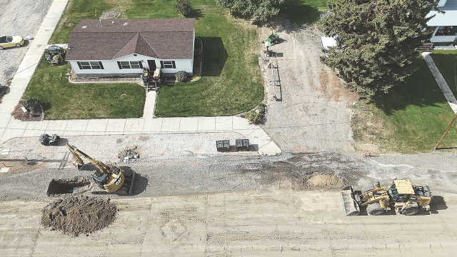 Crews work along a Cowley street earlier this week. The project is expected to be completed during the first part of November. John Bernhisel